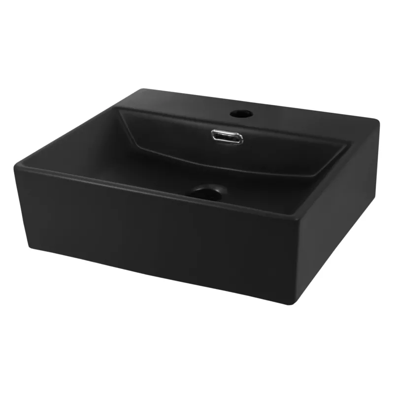 Schwarzes Waschbecken mit abgerundeten Kanten.