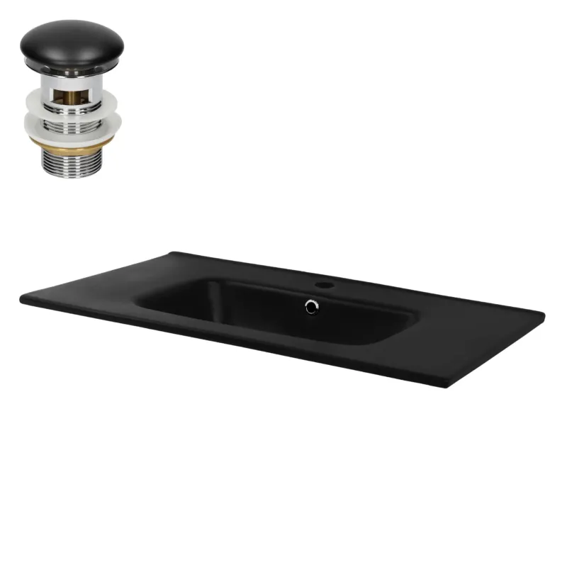 Schwarzes Waschbecken mit Abfluss und Überlauf.